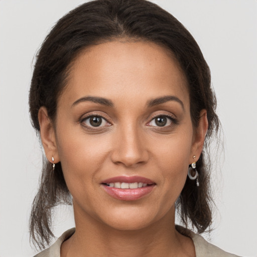 Joyful white young-adult female with long  brown hair and brown eyes