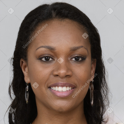 Joyful black young-adult female with long  brown hair and brown eyes