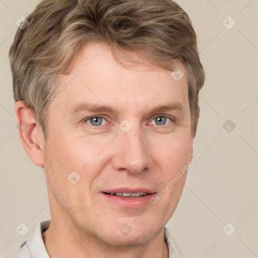 Joyful white adult male with short  brown hair and grey eyes