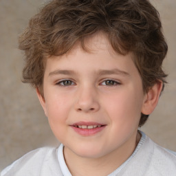 Joyful white child male with short  brown hair and brown eyes