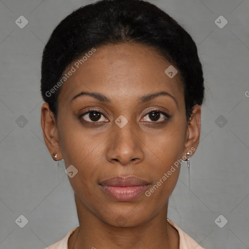 Joyful black young-adult female with short  black hair and brown eyes