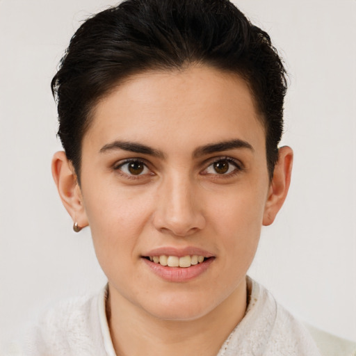 Joyful white young-adult female with short  brown hair and brown eyes