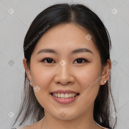 Joyful asian young-adult female with medium  brown hair and brown eyes