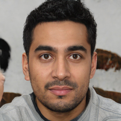 Neutral latino young-adult male with short  black hair and brown eyes
