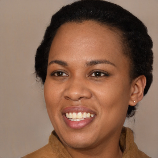 Joyful black young-adult female with medium  black hair and brown eyes
