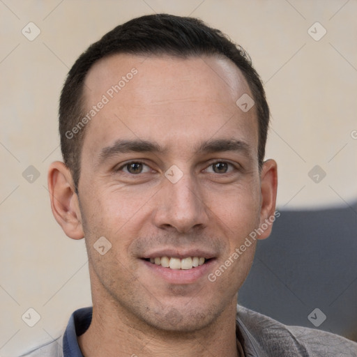 Joyful white adult male with short  brown hair and brown eyes