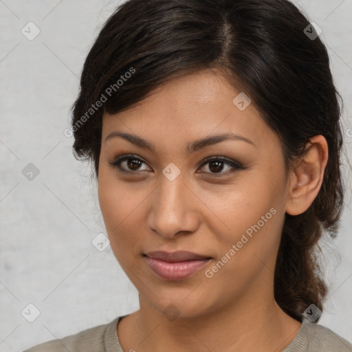 Joyful latino young-adult female with medium  brown hair and brown eyes