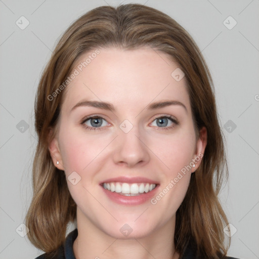 Joyful white young-adult female with medium  brown hair and blue eyes