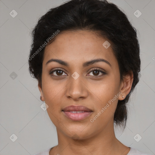 Joyful latino young-adult female with medium  brown hair and brown eyes