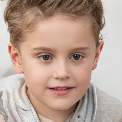 Joyful white child female with short  brown hair and grey eyes