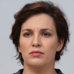 Neutral white adult female with medium  brown hair and brown eyes