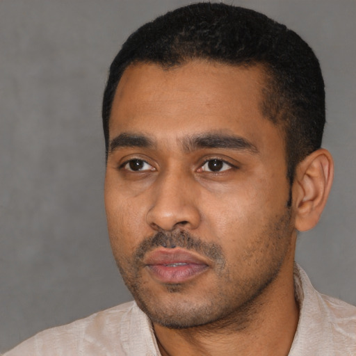 Neutral latino young-adult male with short  black hair and brown eyes