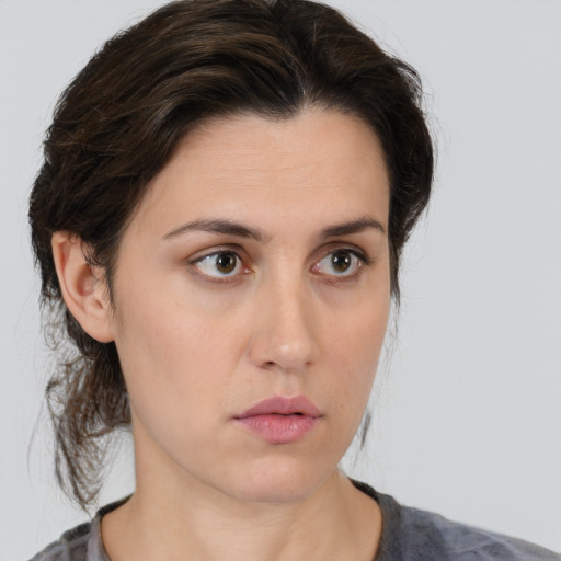 Neutral white young-adult female with medium  brown hair and brown eyes