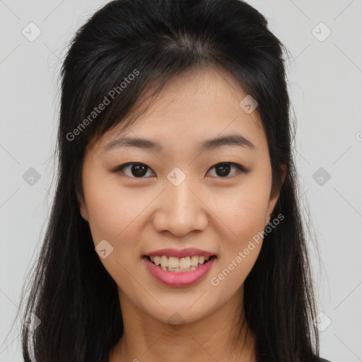 Joyful asian young-adult female with long  brown hair and brown eyes