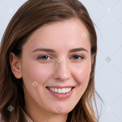 Joyful white young-adult female with long  brown hair and blue eyes