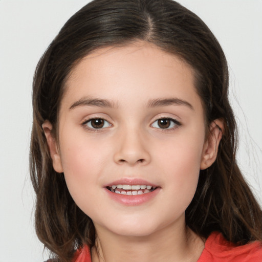 Joyful white child female with long  brown hair and brown eyes