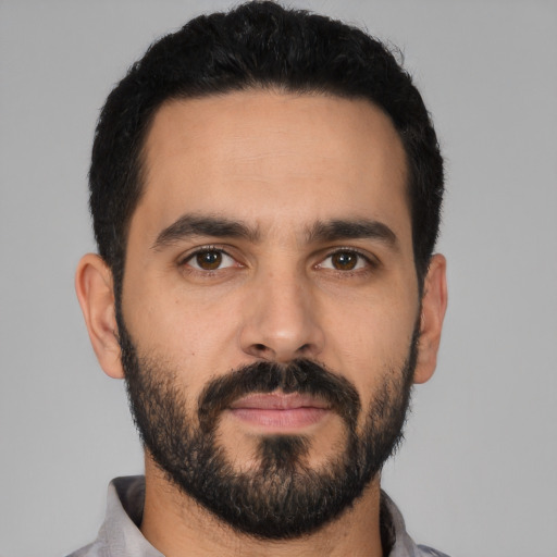 Neutral latino young-adult male with short  black hair and brown eyes