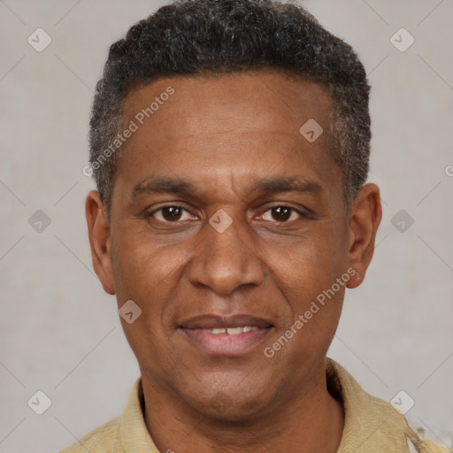 Joyful black adult male with short  brown hair and brown eyes