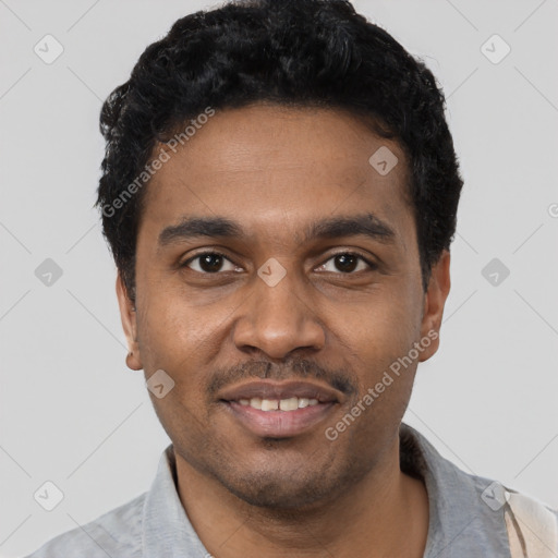 Joyful black young-adult male with short  black hair and brown eyes