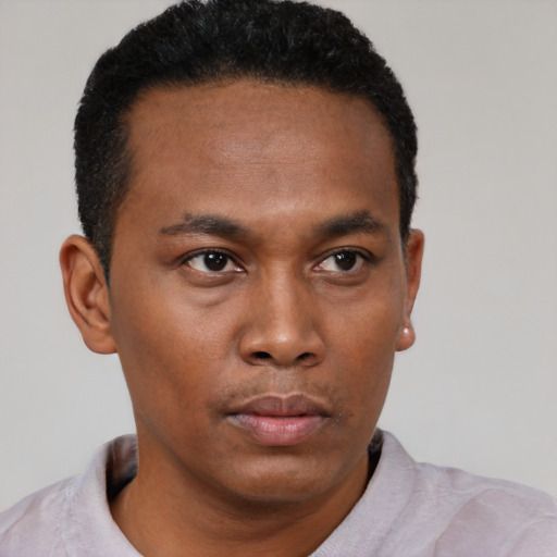 Neutral black young-adult male with short  black hair and brown eyes