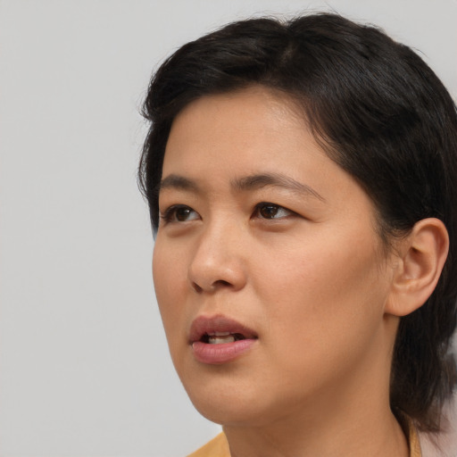 Neutral asian young-adult female with short  brown hair and brown eyes