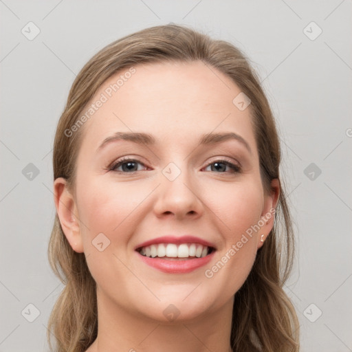 Joyful white young-adult female with long  brown hair and grey eyes