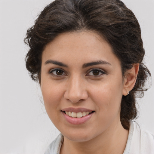 Joyful white young-adult female with medium  brown hair and brown eyes