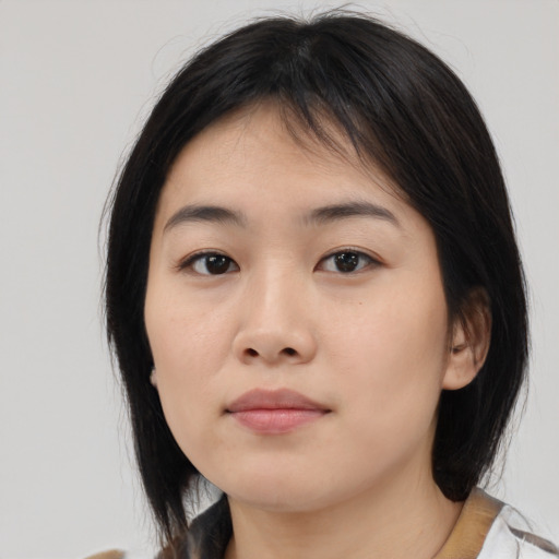Neutral asian young-adult female with medium  brown hair and brown eyes