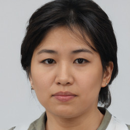 Neutral asian young-adult female with medium  brown hair and brown eyes