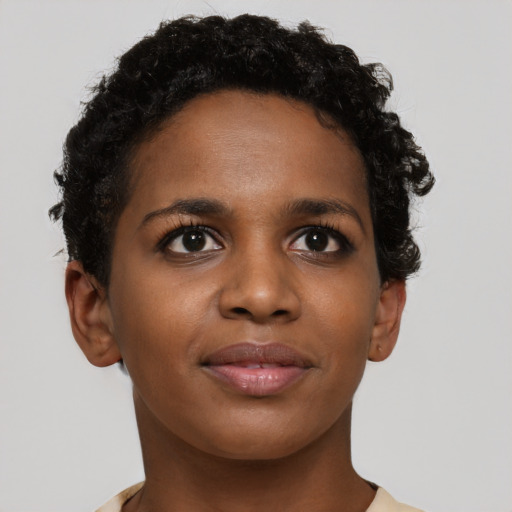 Joyful black young-adult female with short  brown hair and brown eyes