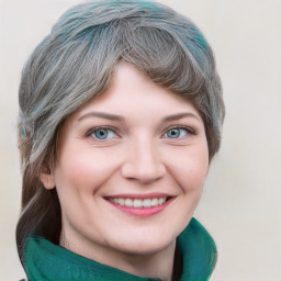 Joyful white young-adult female with long  brown hair and blue eyes