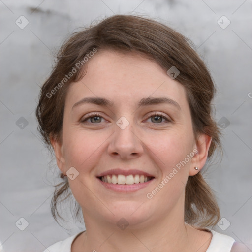 Joyful white young-adult female with medium  brown hair and grey eyes