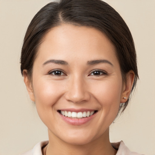 Joyful white young-adult female with medium  brown hair and brown eyes