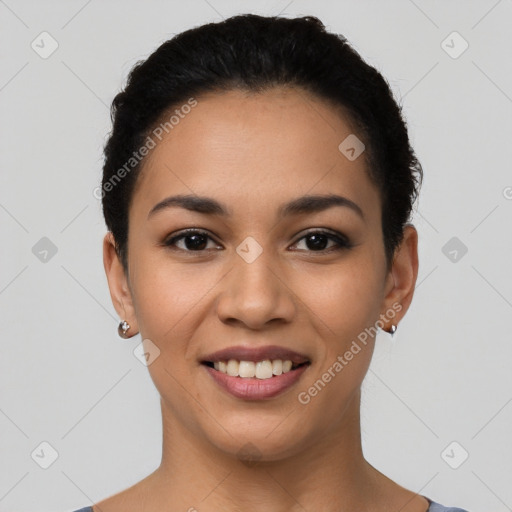 Joyful latino young-adult female with short  brown hair and brown eyes