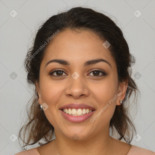 Joyful latino young-adult female with medium  brown hair and brown eyes