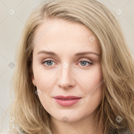 Joyful white young-adult female with long  brown hair and blue eyes