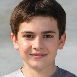 Joyful white child male with short  brown hair and brown eyes