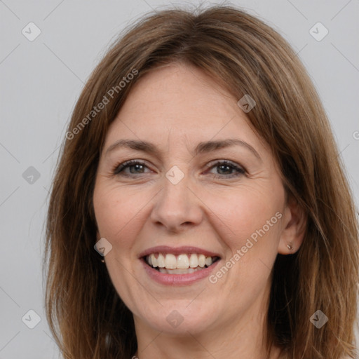 Joyful white adult female with medium  brown hair and brown eyes