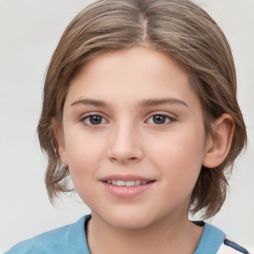 Joyful white child female with medium  brown hair and grey eyes