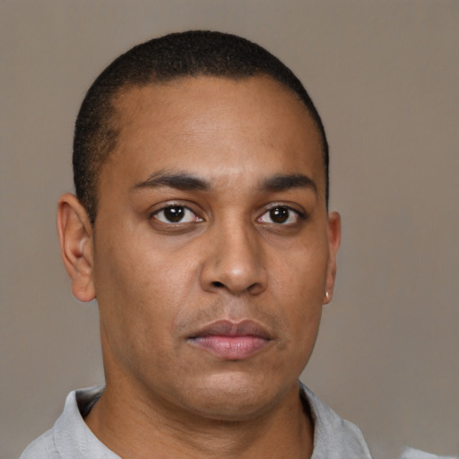 Neutral latino young-adult male with short  brown hair and brown eyes