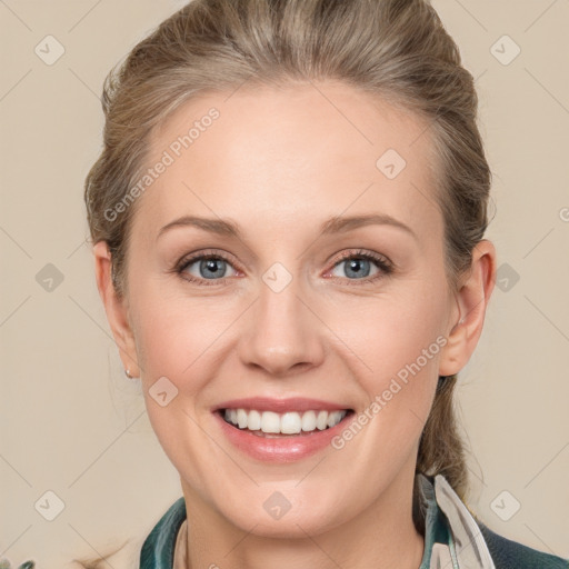 Joyful white adult female with medium  brown hair and blue eyes