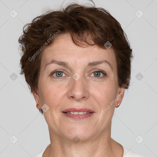 Joyful white adult female with short  brown hair and grey eyes