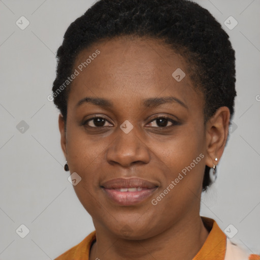 Joyful black young-adult female with short  brown hair and brown eyes