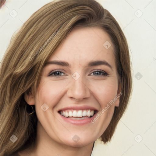 Joyful white young-adult female with long  brown hair and green eyes