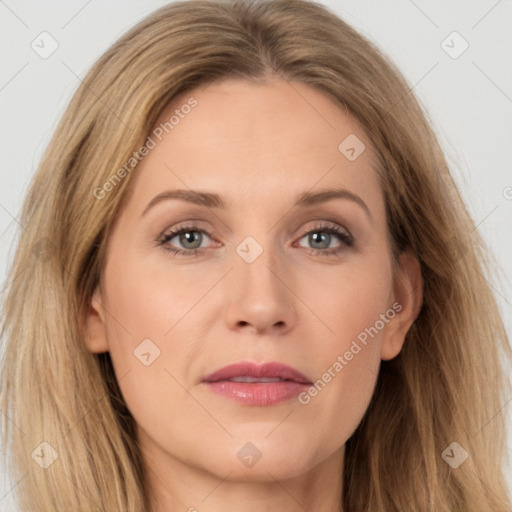 Joyful white adult female with long  brown hair and brown eyes