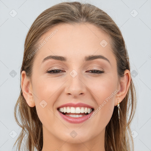 Joyful white young-adult female with long  brown hair and grey eyes