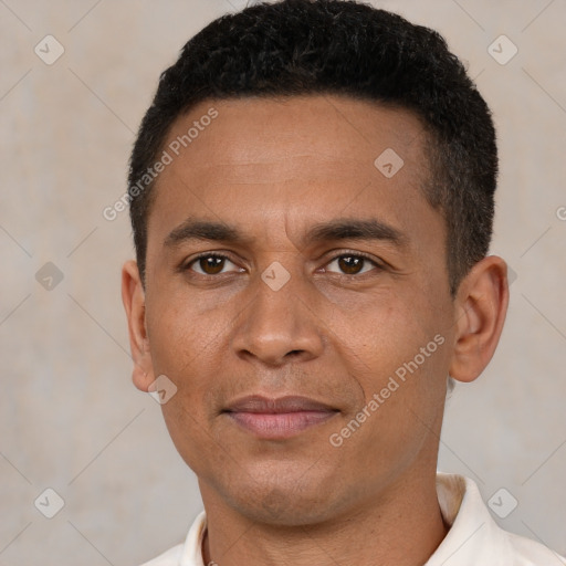 Joyful latino adult male with short  black hair and brown eyes