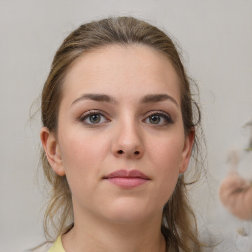 Neutral white young-adult female with medium  brown hair and grey eyes