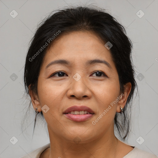 Joyful asian adult female with medium  brown hair and brown eyes