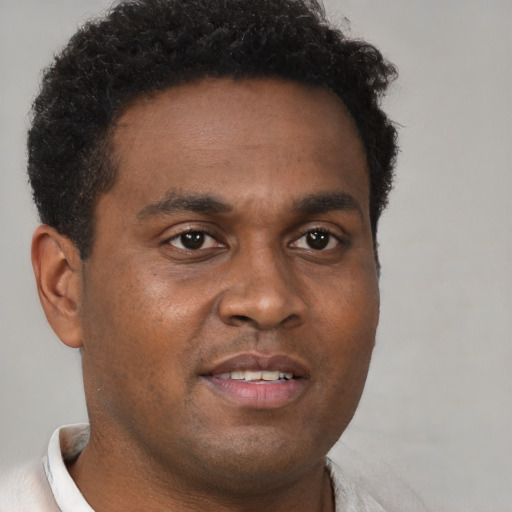 Neutral black young-adult male with short  brown hair and brown eyes